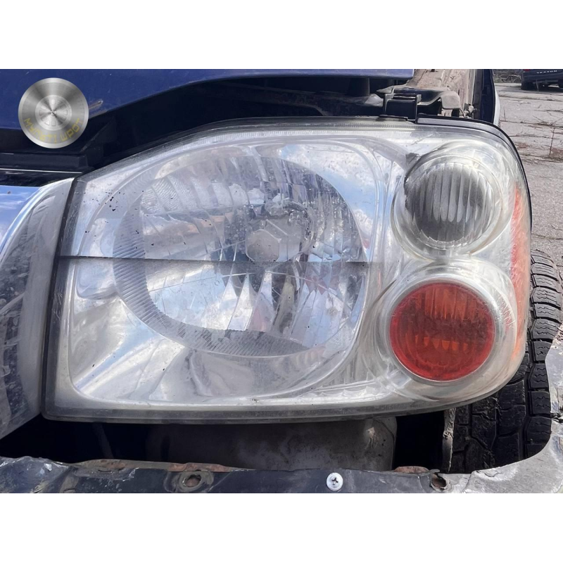 Фара передня ліва Nissan Navara D22